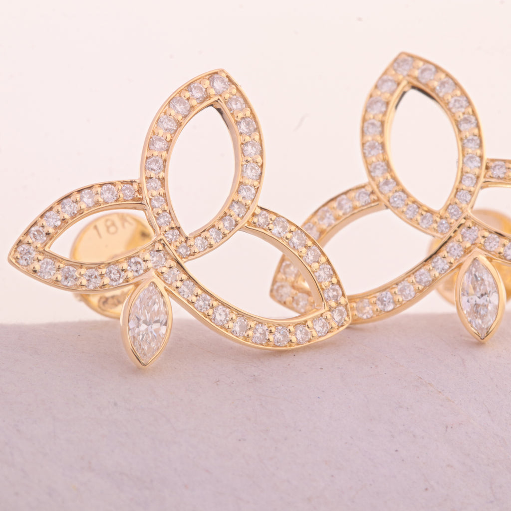 18ct yellow gold diamond lotus flower studs 0.60ct diamond earrings Lotus flower diamond earrings Yellow gold diamond studs Fine jewelry earrings Diamond flower studs Designer diamond earrings Luxury diamond studs High-end gold earrings Classic butterfly back earrings