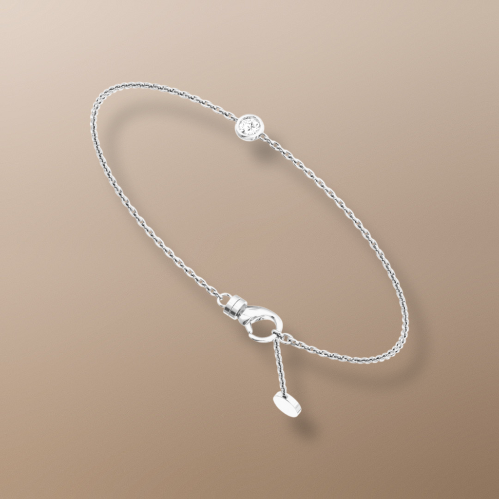18ct white gold bracelet Solitaire diamond bracelet 0.15ct diamond jewelry Elegant diamond bracelet High-quality diamond accessory Classic four-prong setting bracelet Timeless jewelry piece