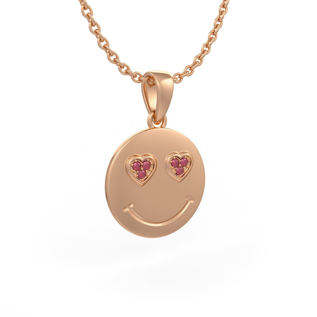 Rose gold smiley face pendant with heart shaped gemstones
