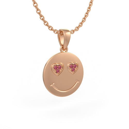 Rose gold smiley face pendant with heart shaped gemstones