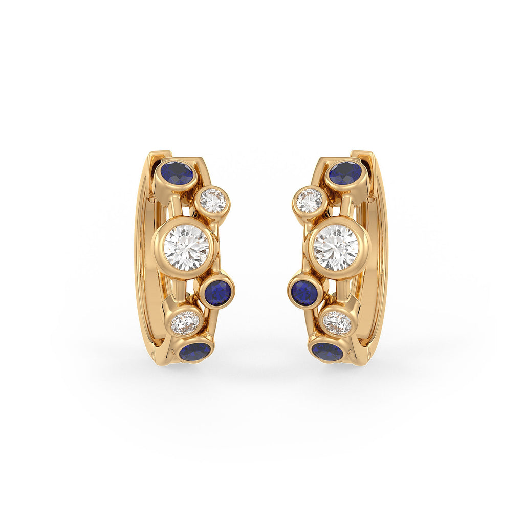 Gold hoop earrings with diamonds and blue stones on a white background