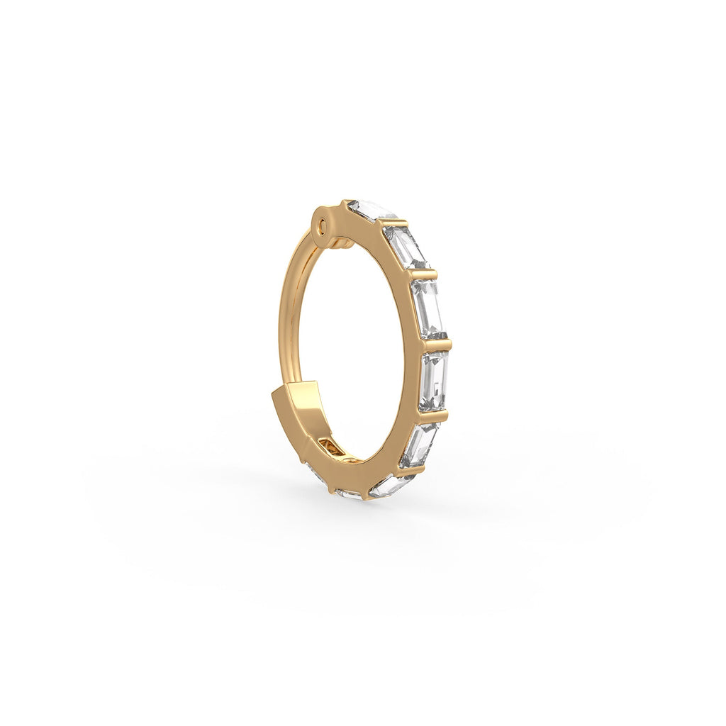 Gold hoop earring with embedded diamonds on a white background
