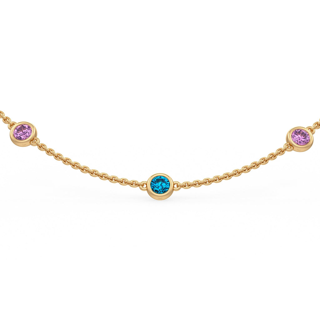 Close-up view of colourful gemstones set along a gold chain