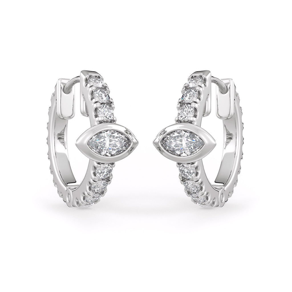 Pair of silver hoop earrings with clear gemstones on a white background