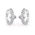Pair of silver hoop earrings with clear gemstones on a white background