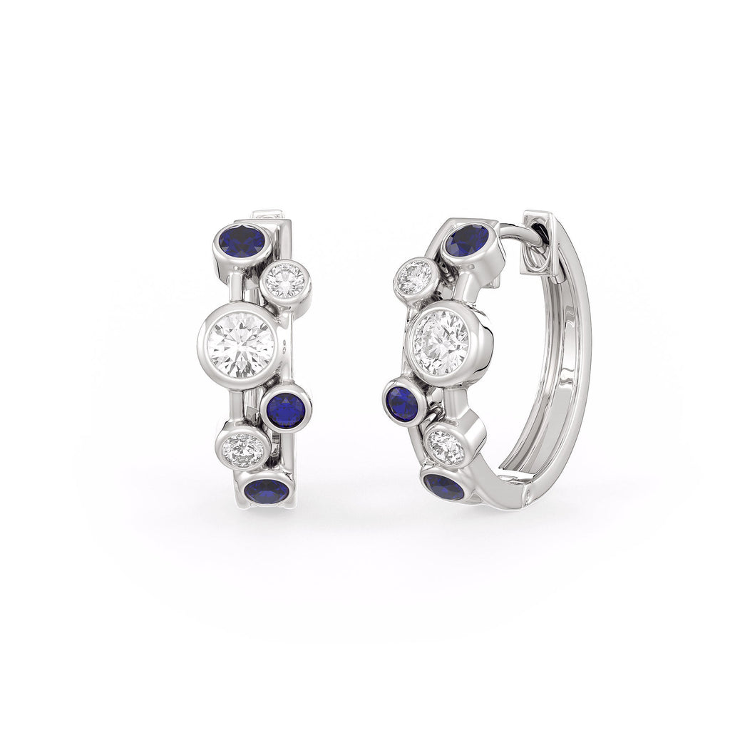 Pair of silver hoop earrings with blue gemstones