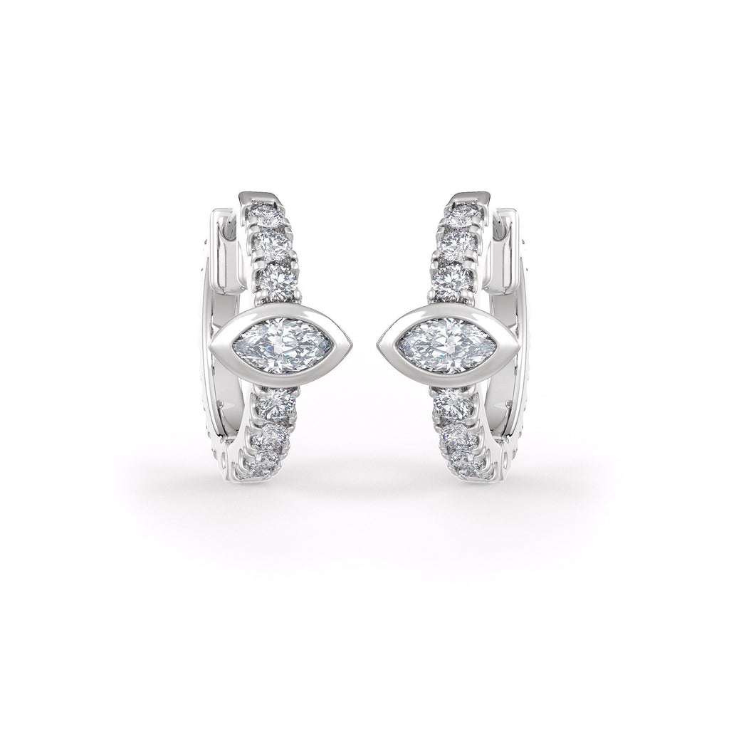 Pair of diamond hoop earrings on a white background