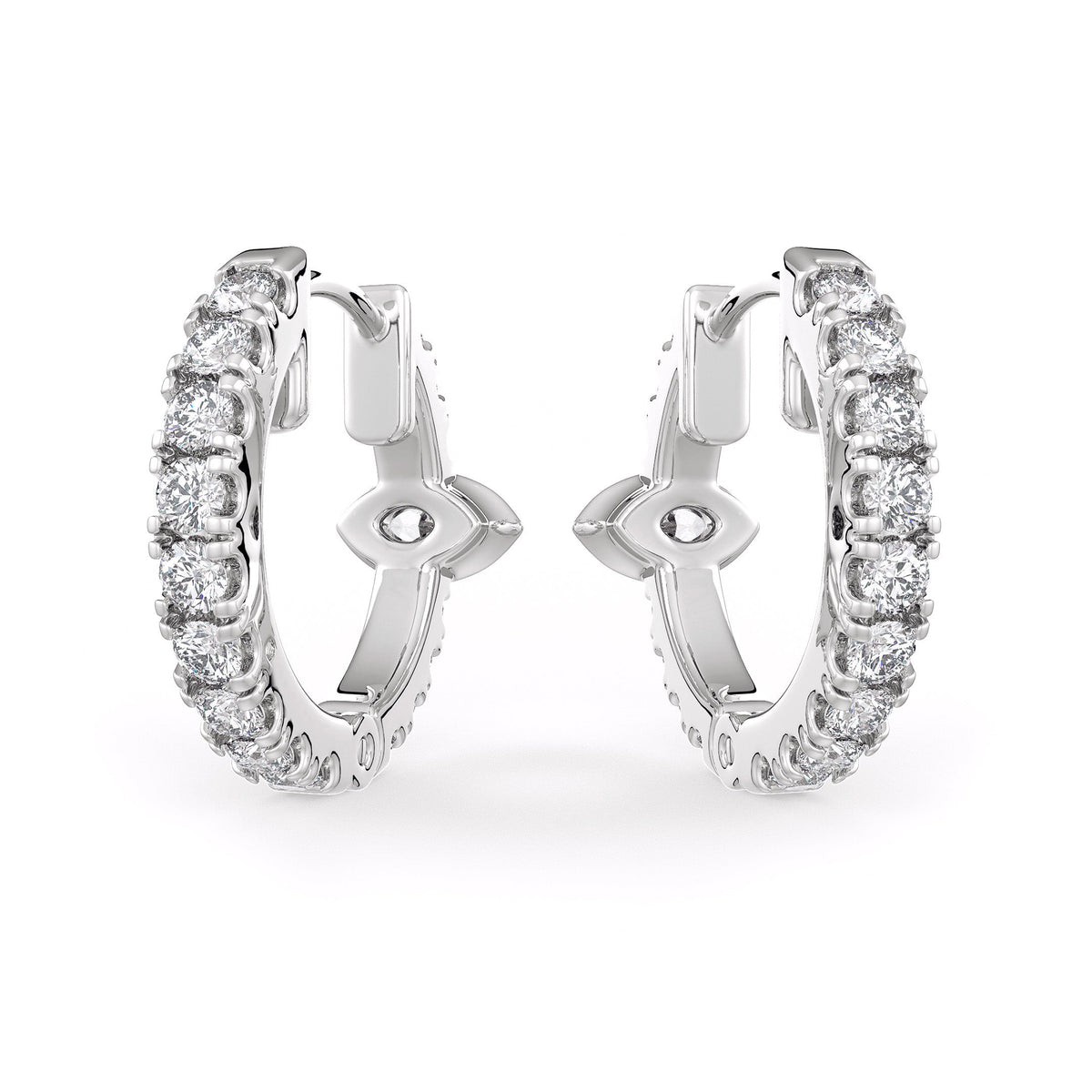 Pair of silver hoop earrings with clear gemstones on a white background