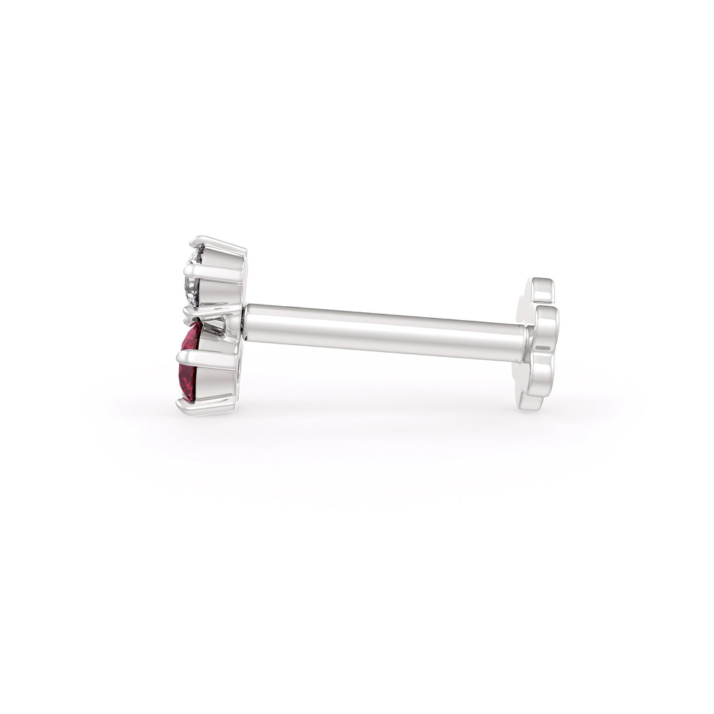 Silver nose stud with a red gemstone on a white background