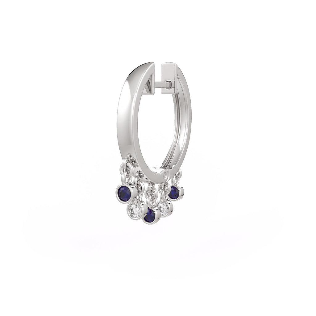 Silver hoop earring with small stones on a white background