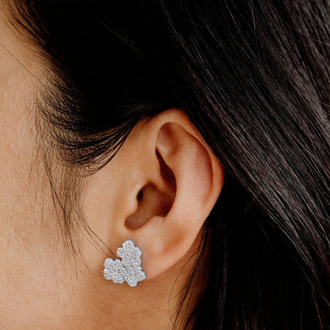Fine jewellery flower earrings featuring a cluster of sparkling diamonds