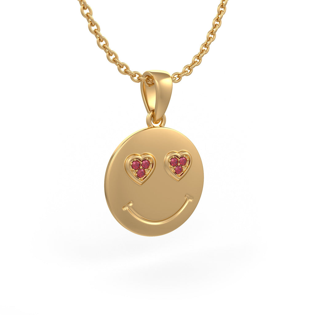 Fine yellow gold emoji necklace featuring sparkling ruby heart eyes
