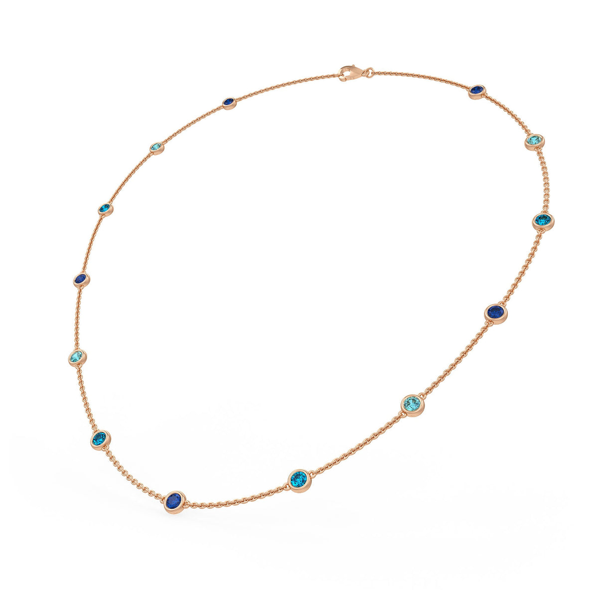A gold chain necklace with small round bezel-set blue and turquoise stones, displayed on a clean white background