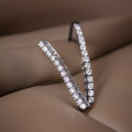 Boucles d'oreilles pendantes de tennis en or 1 carat