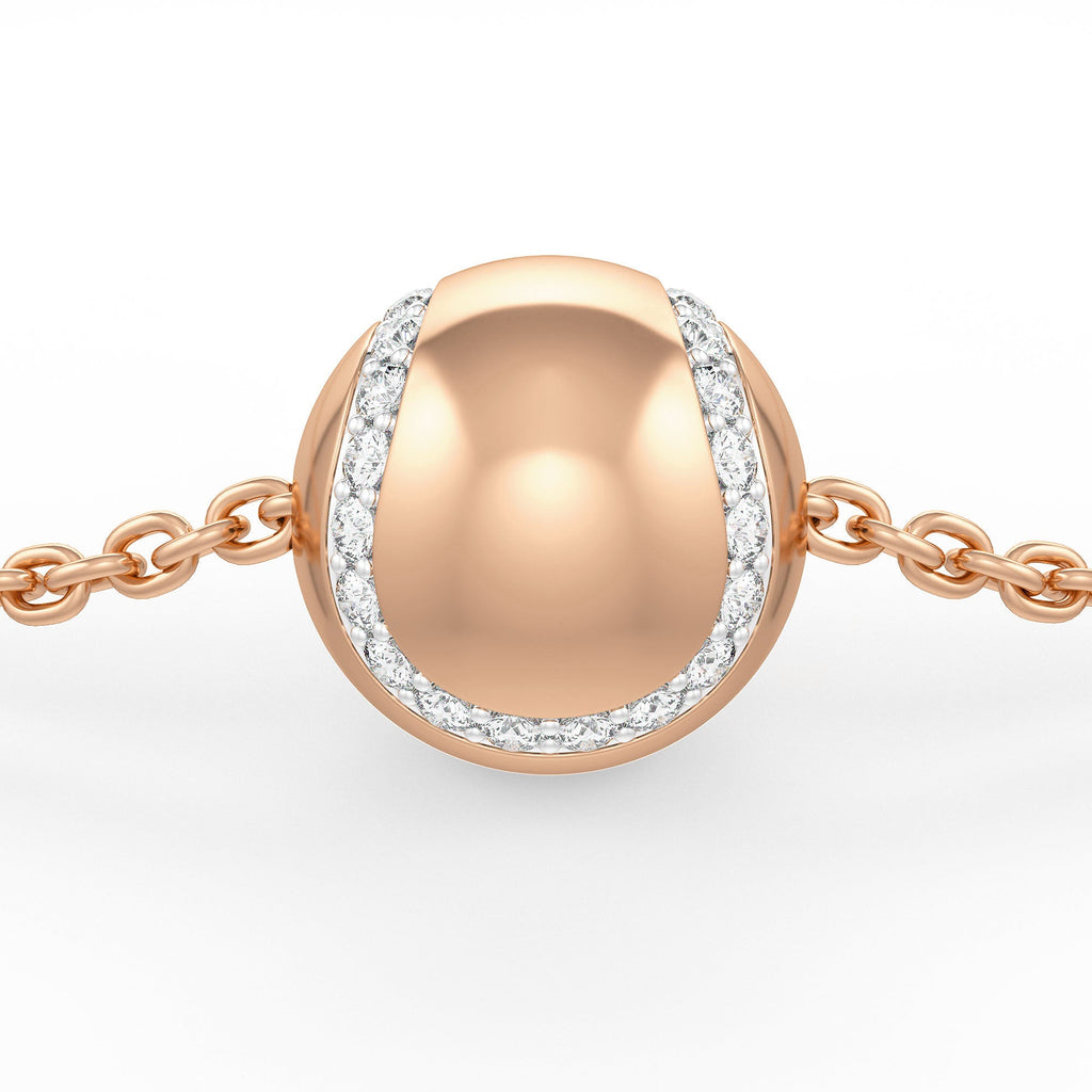 Rose gold bracelet with a round, beaded design and diamond accents