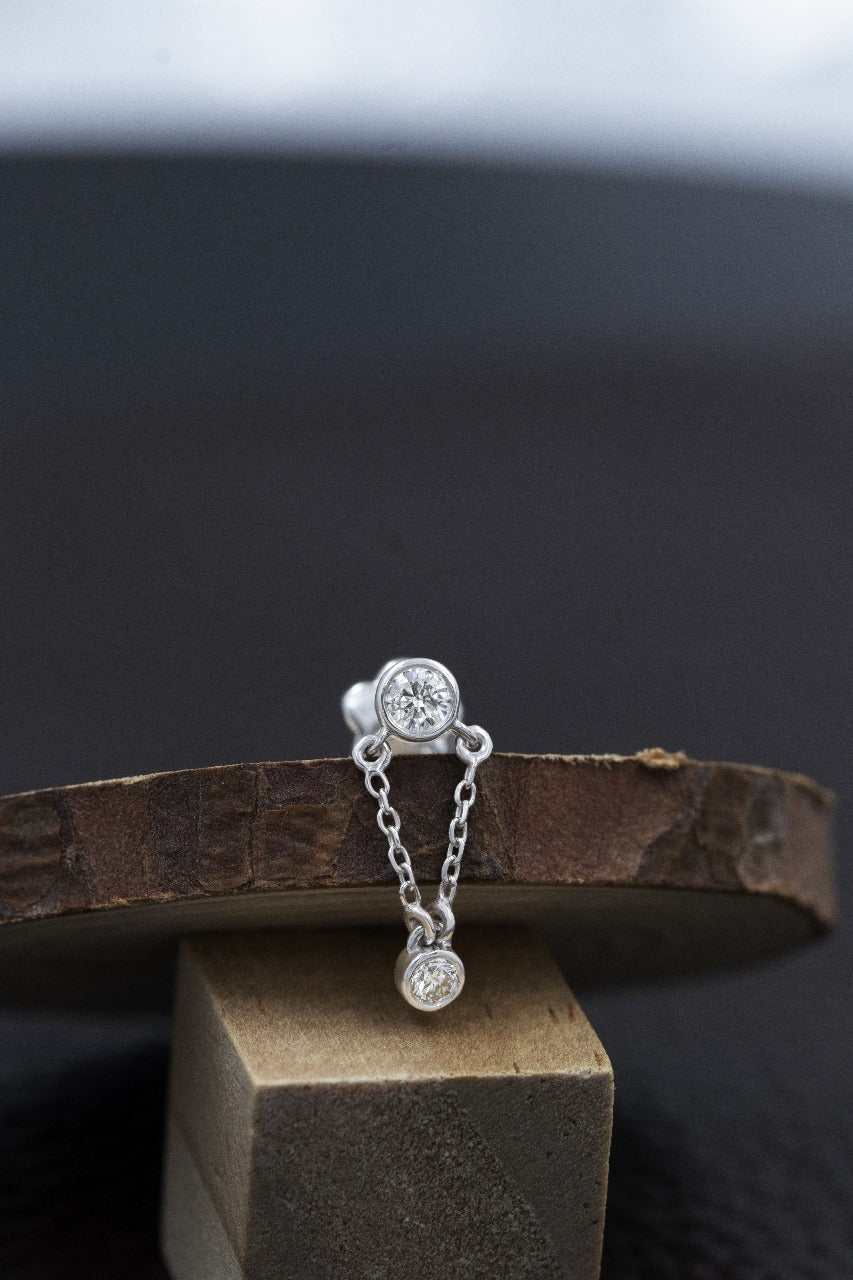 Singular white gold diamond earring