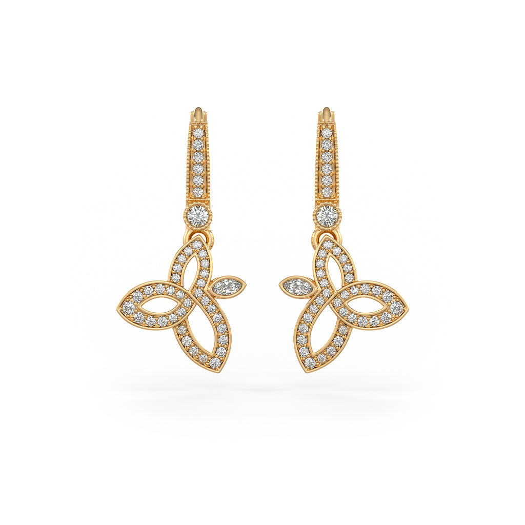 Gold earrings with diamond accents on a white background