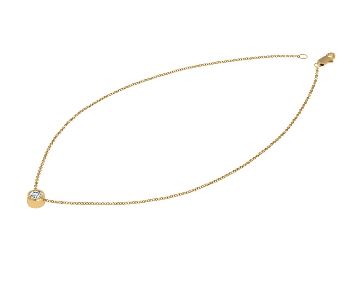 Elegant yellow gold necklace featuring a single bezel set diamond