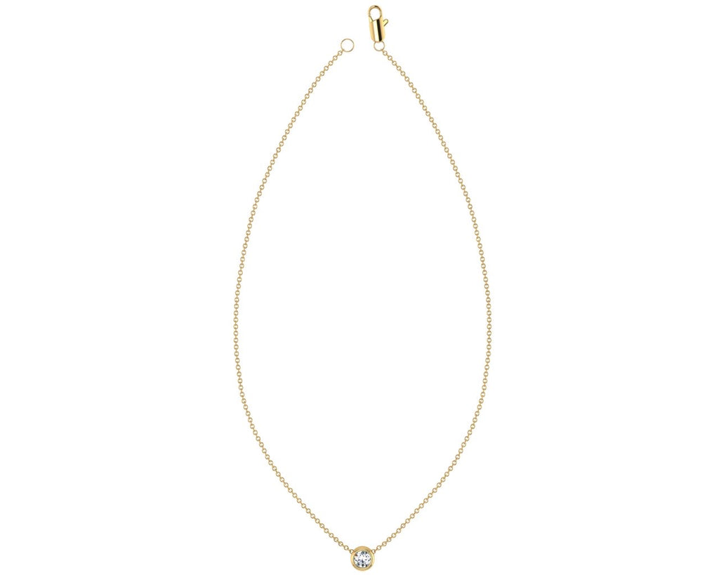 Bezel set 0.11ct diamond pendant on yellow gold necklace