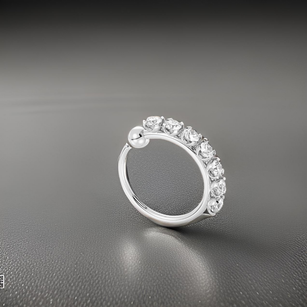 Silver ring with diamonds on a gray background