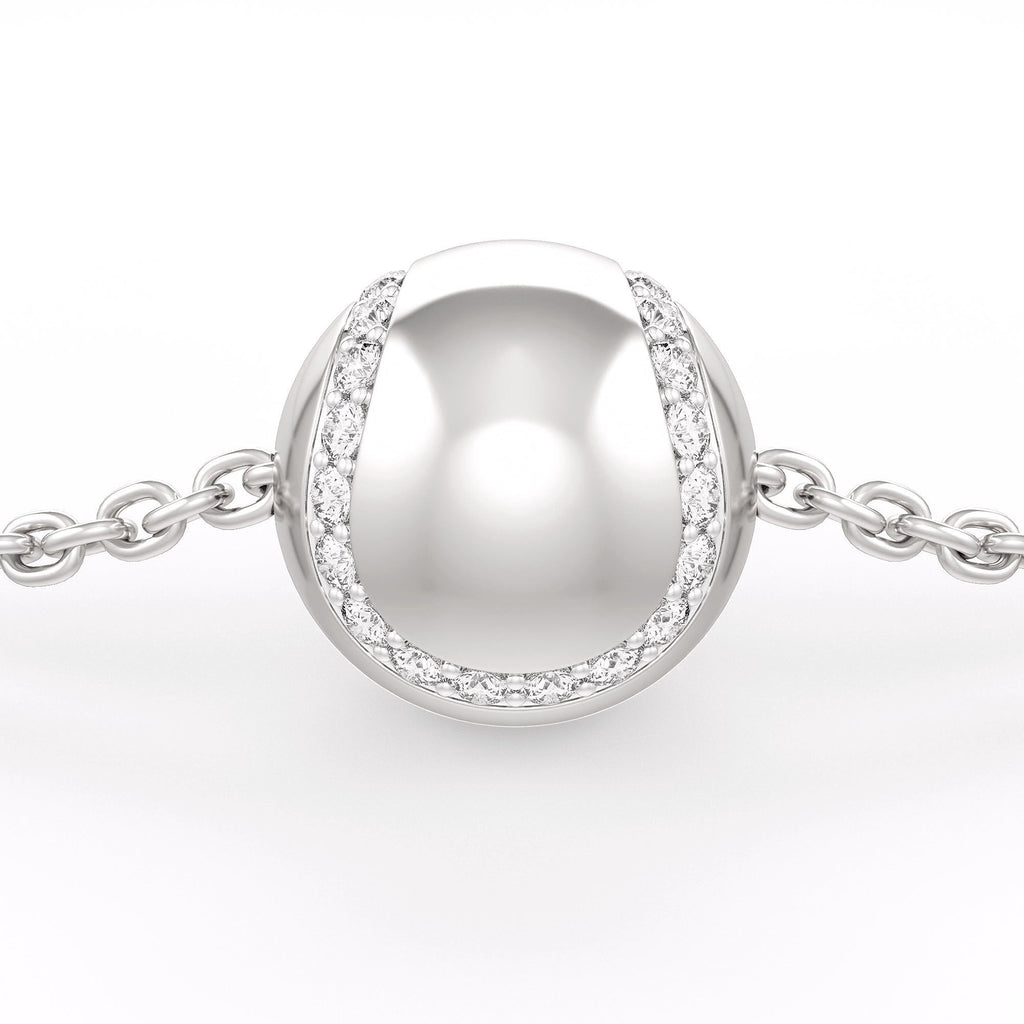 Bracelet in white gold with a round silver charm on a white background