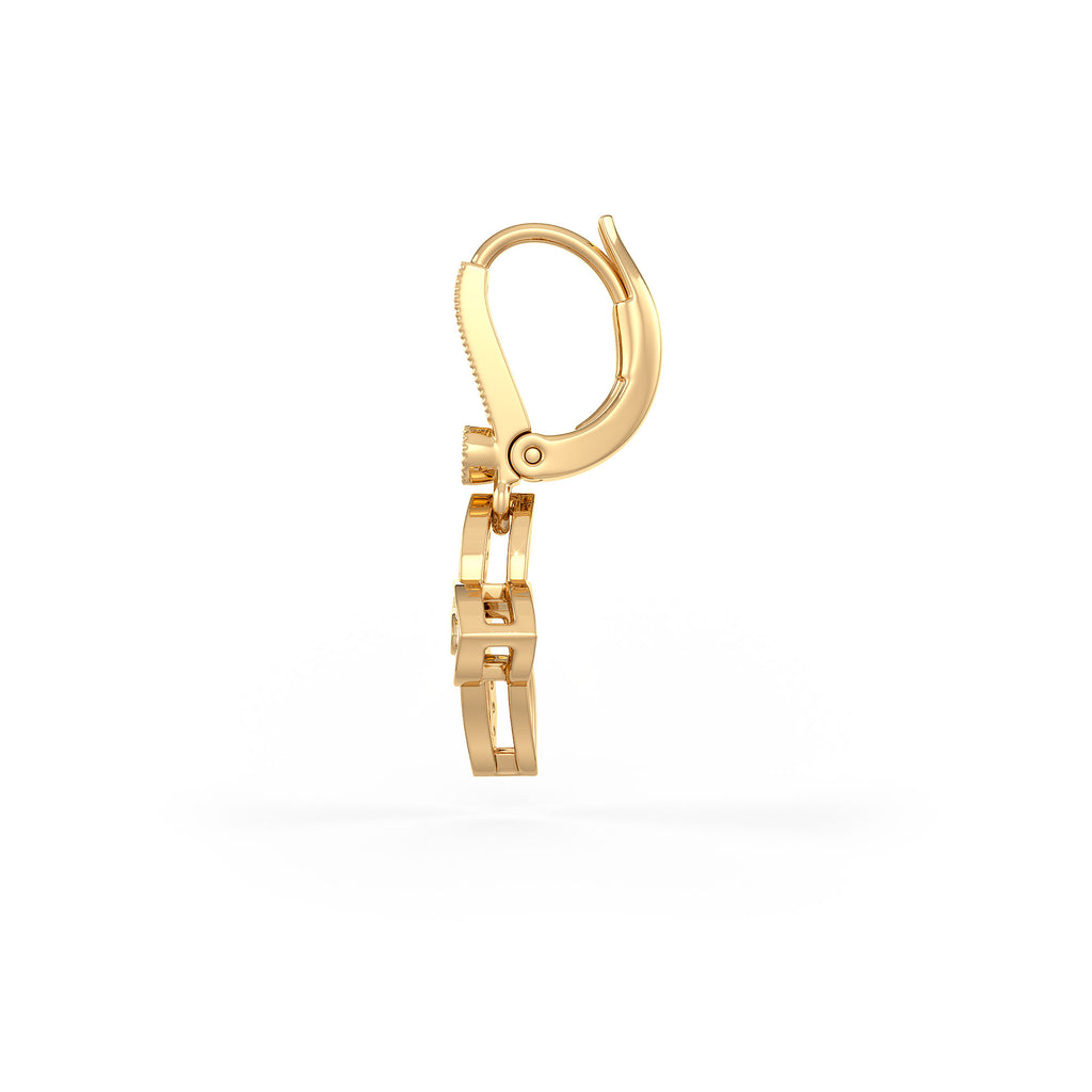 Gold earring on a white background