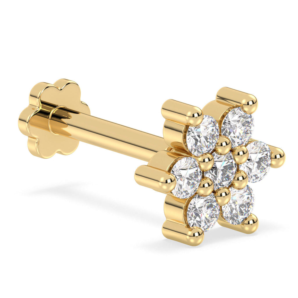 Gold nose stud with diamond stones on a white background