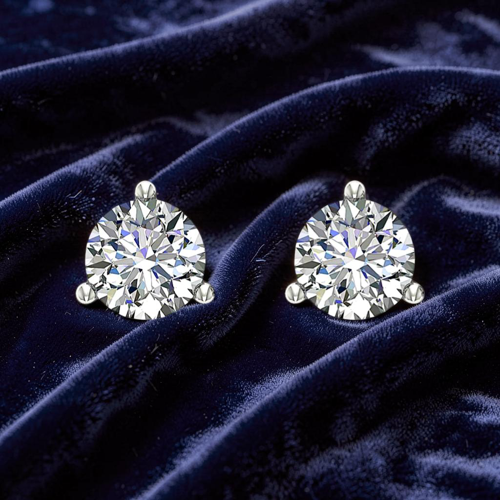 Close up of 1ct diamond stud earrings in luxurious 18ct gold