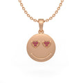 Rose gold smiley face pendant with heart shaped eyes on a white background