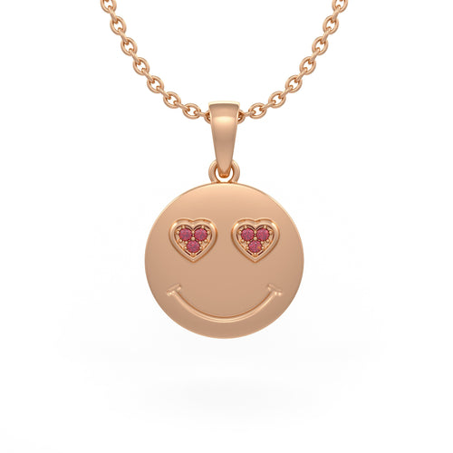 Rose gold smiley face pendant with heart shaped eyes on a white background