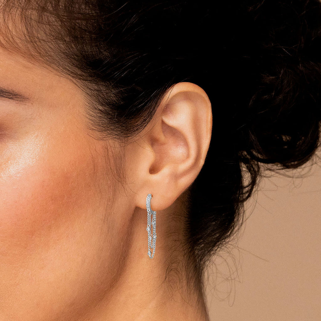 Close-up of an ear wearing a hoop earring