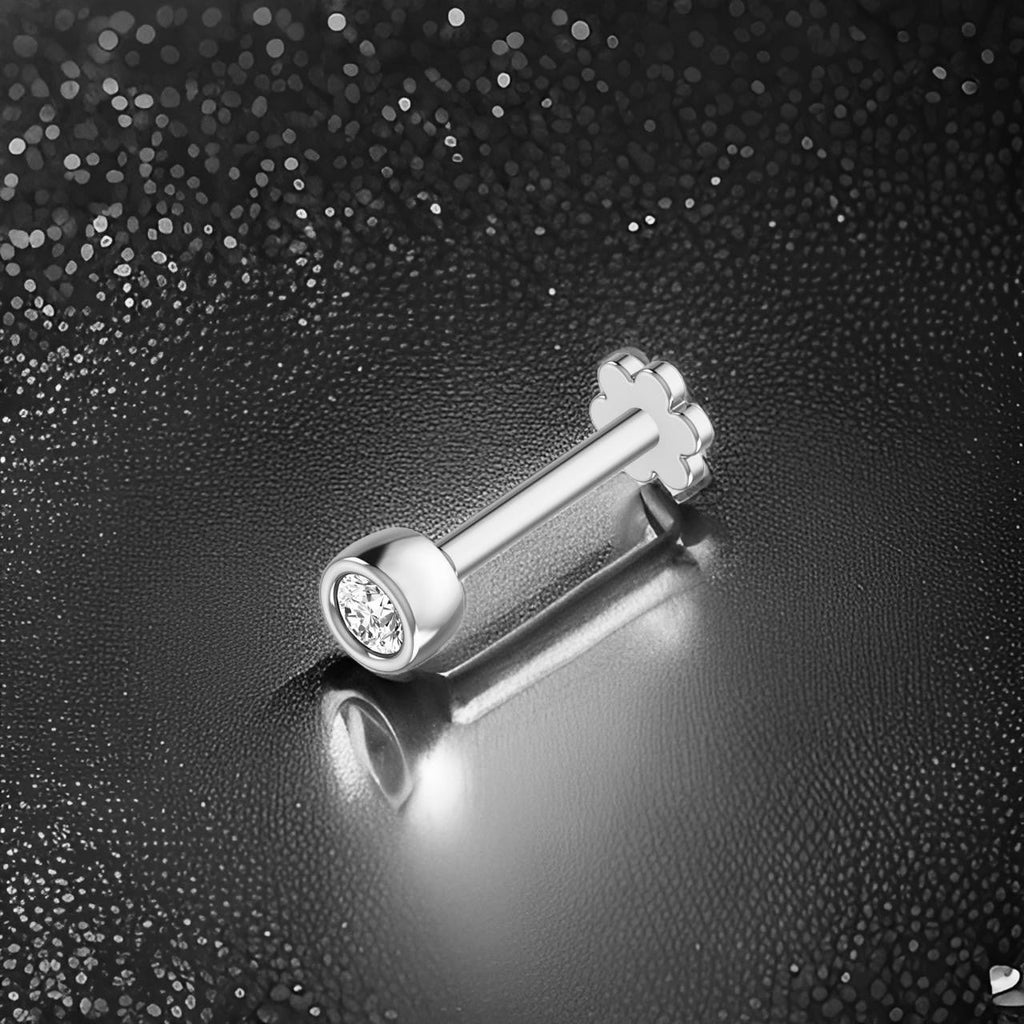Beautiful Silver nose stude with a gemstone on a textured black background