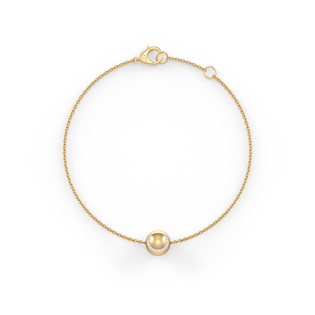 Bracelet with a small round gold charm on a white background