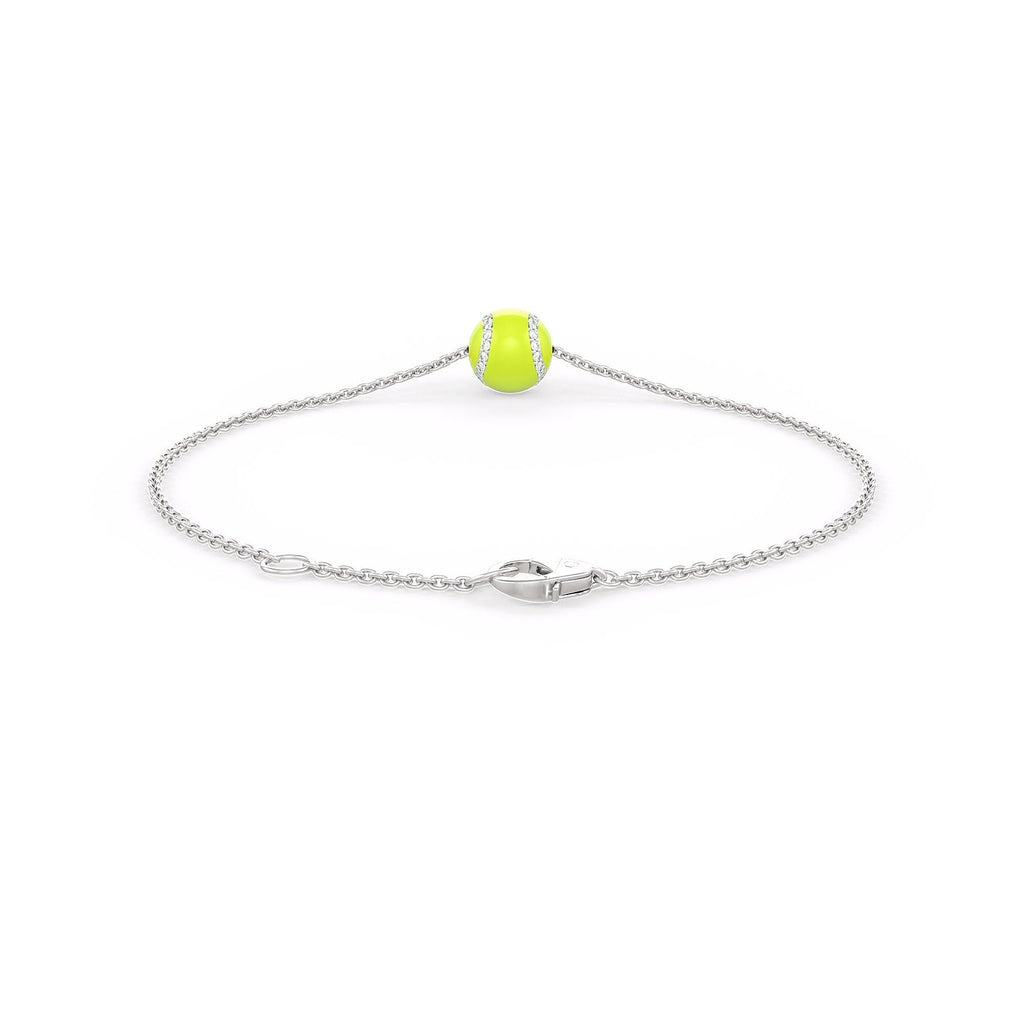 Silver bracelet with a green bead on a white background