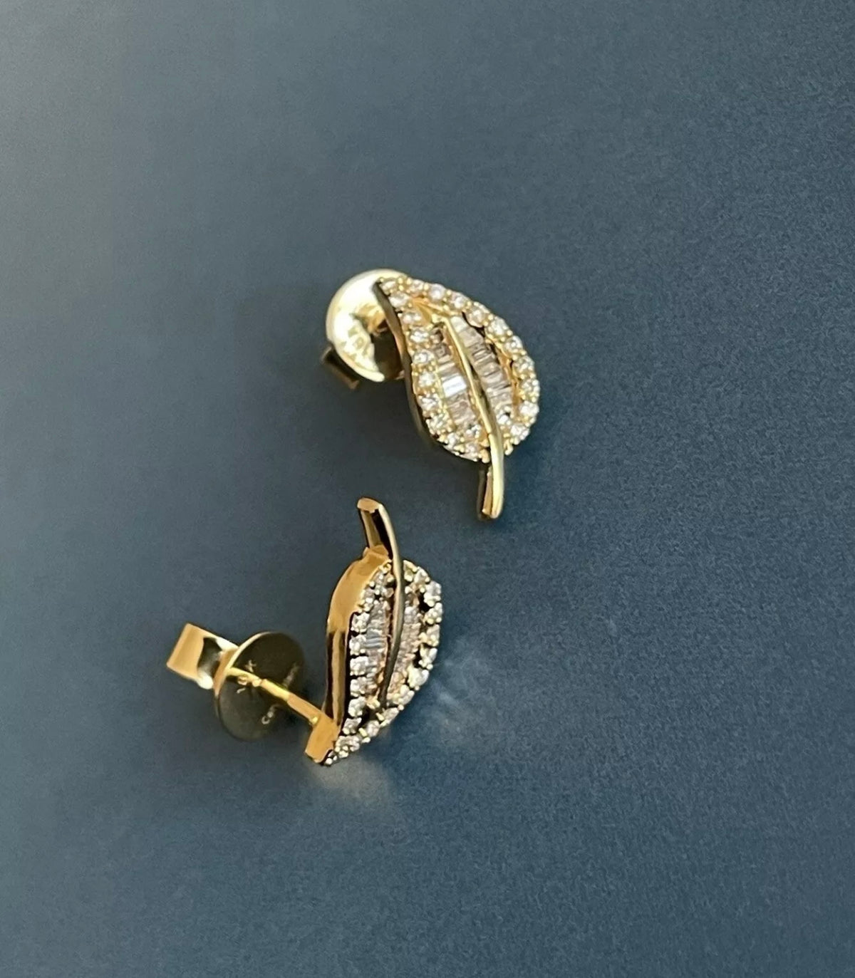 Swiss inspired leaf diamond stud earrings gold