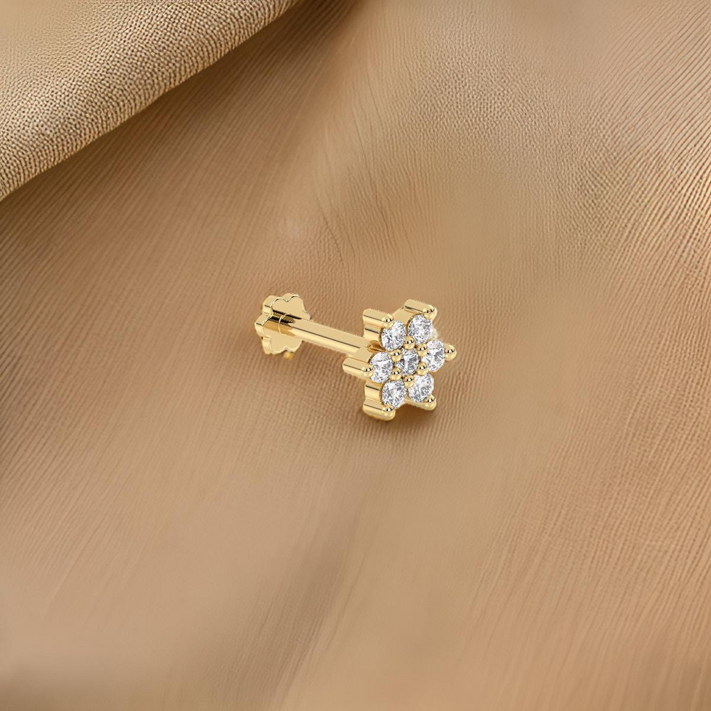 Stylish yellow gold nose stud with clear gemstones