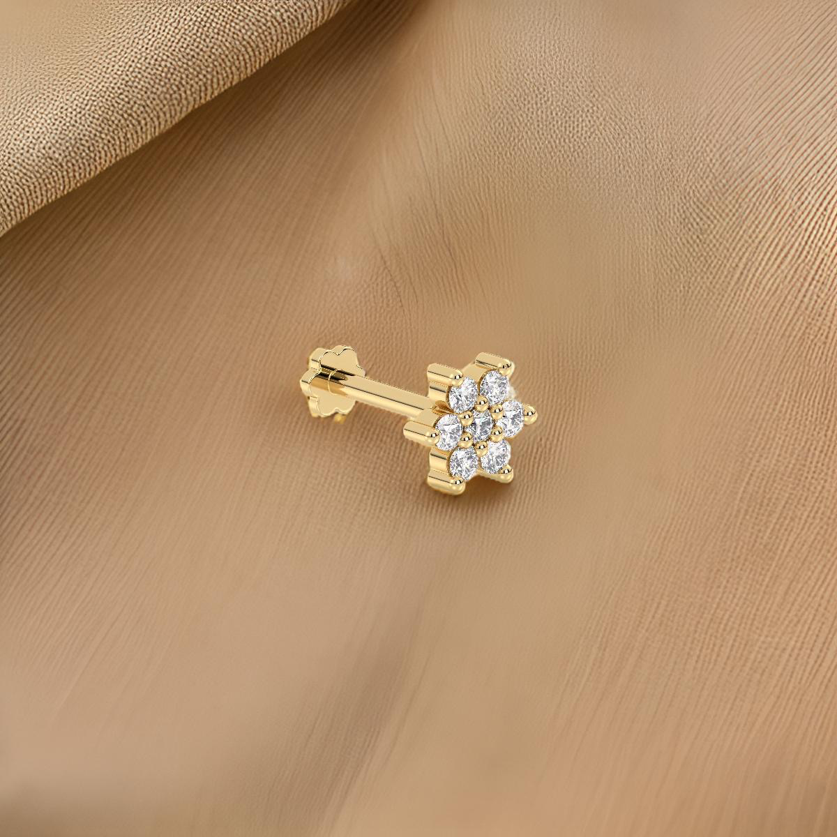 Stylish yellow gold nose stud with clear gemstones