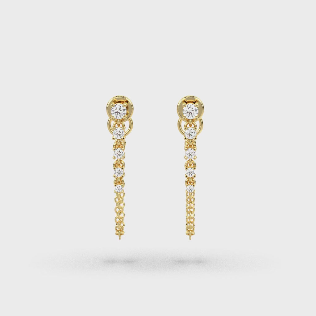 Boucles d'oreilles en or jaune serties de diamants (0,51 ct) et d'une chaîne.
