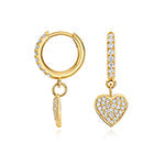 Close up of lab grown diamond heart huggie earrings