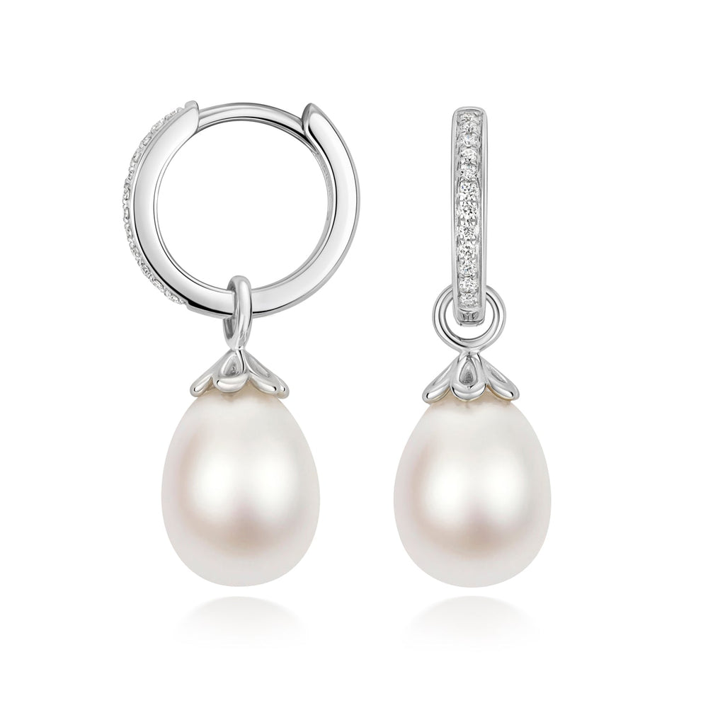 Silver earrings featuring lab-grown diamond accents and oval freshwater pearls from Hatton Garden Collection.