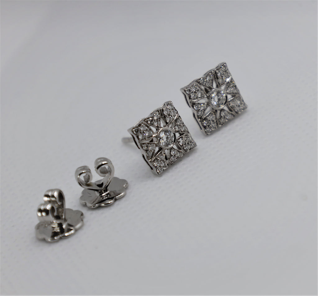 Elegant Cervin Blanc diamond earrings with intricate white gold