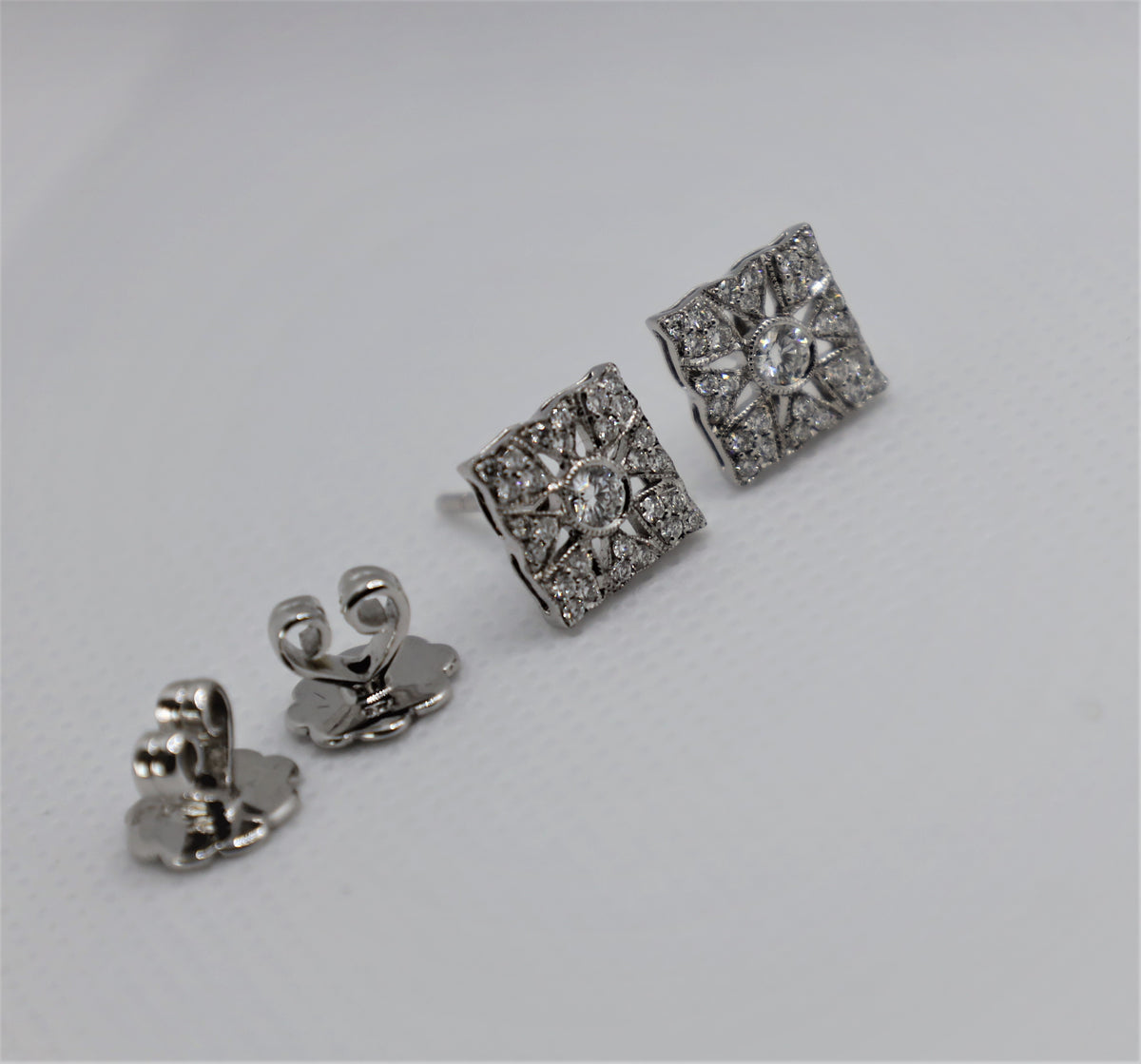 Elegant Cervin Blanc diamond earrings with intricate white gold