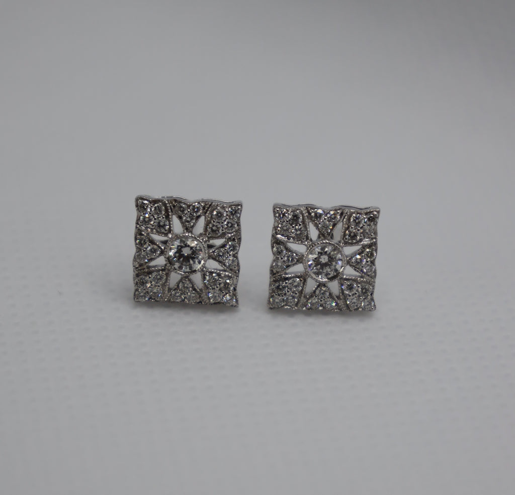 Luxury diamond earrings featuring an intricate white gold