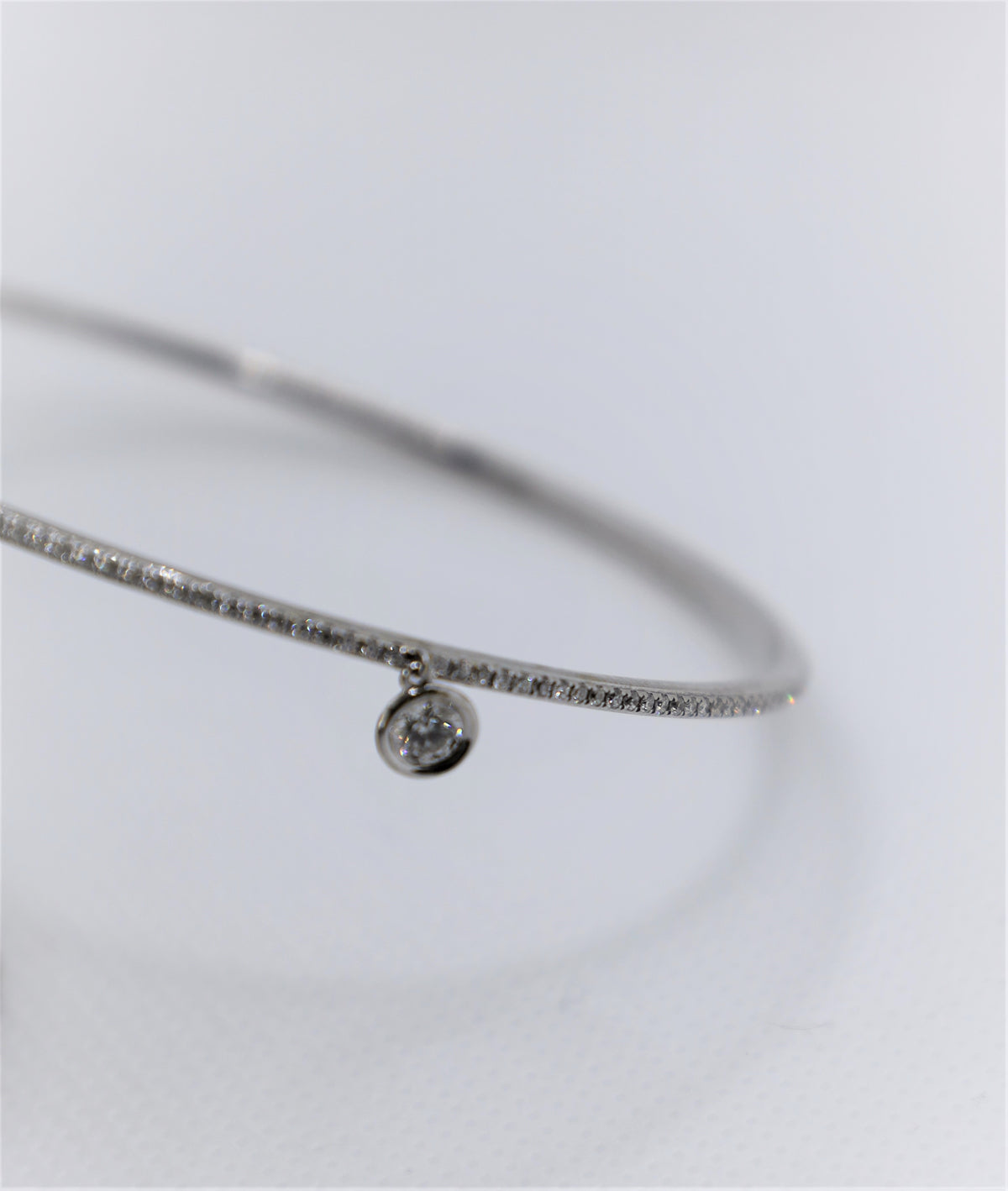 White Gold Eternity Diamond Bangle with solitaire charm