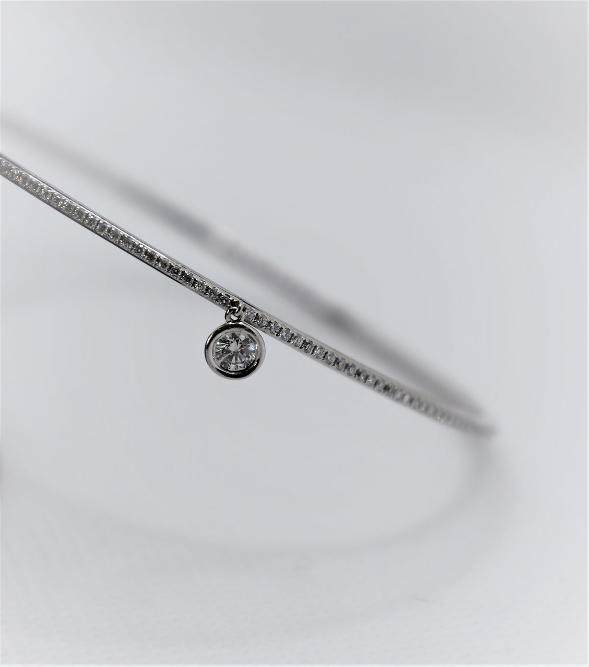 White Gold Eternity Diamond Bangle with solitaire charm