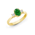 Bague en or jaune 18 carats sertie de diamants, d'émeraudes et de trois pierres