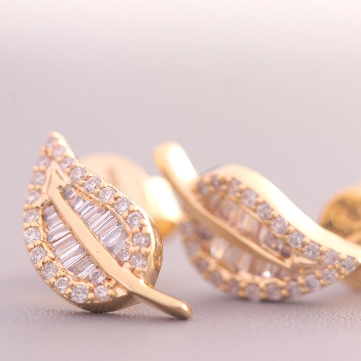 Modern chic yellow gold leaf diamond earrings