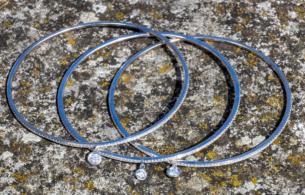 White Gold Eternity Diamond Bangle with solitaire charm