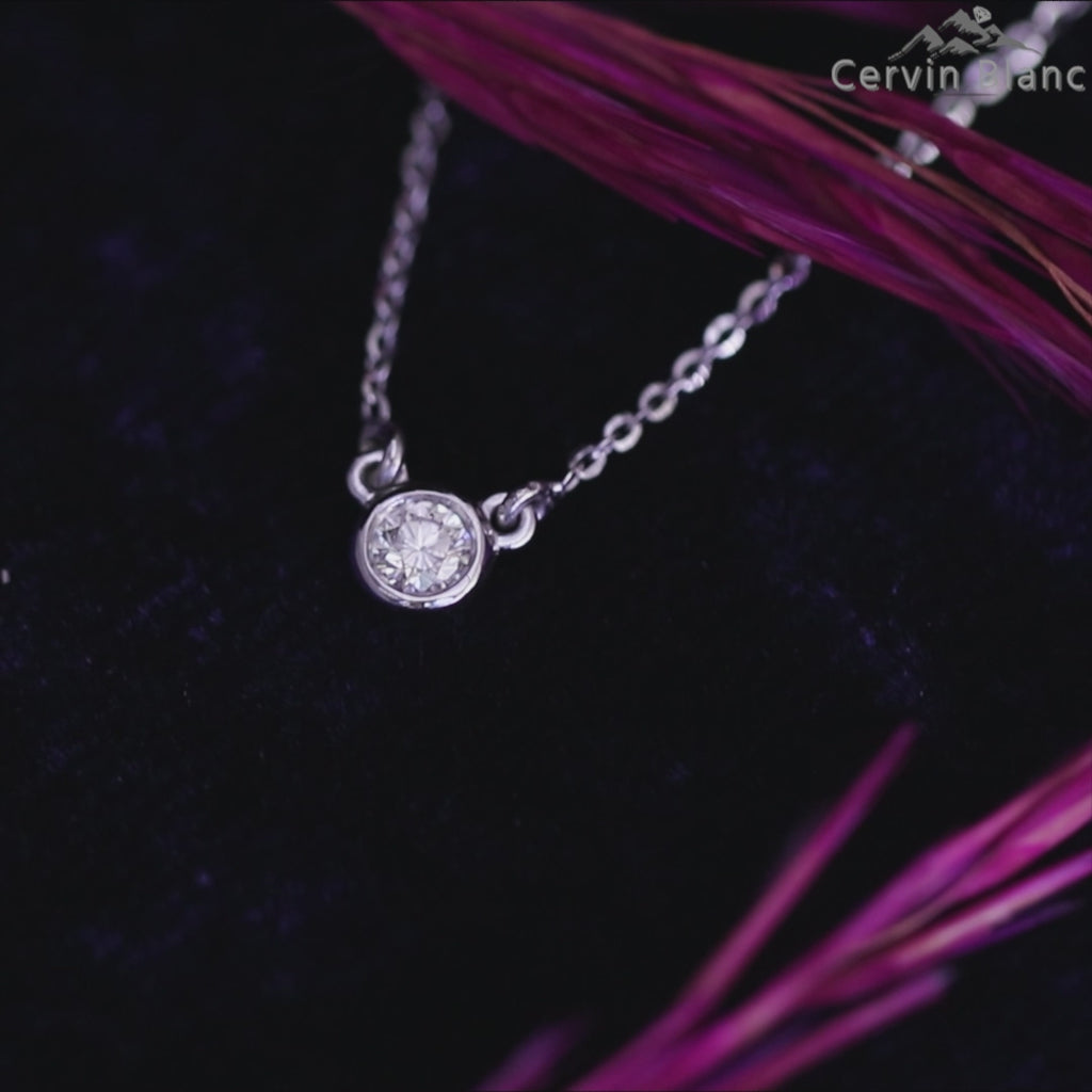 Bezel set solitaire diamond pendant with delicate rose gold chain