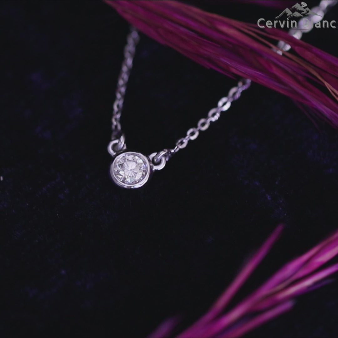 Bezel set solitaire diamond pendant with delicate rose gold chain